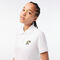 تيشيرت بولو بطبعة تمساح للنساء مجموعة Lacoste x Netflix لاكوست تيشيرت بولو بطبعة تمساح للنساء مجموعة lacoste x netflix