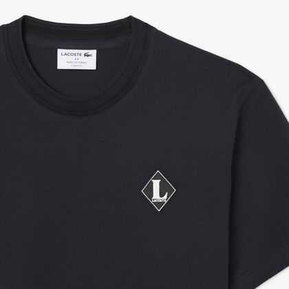 تيشيرت فرنسي الصنع مزين بشعار المااركة