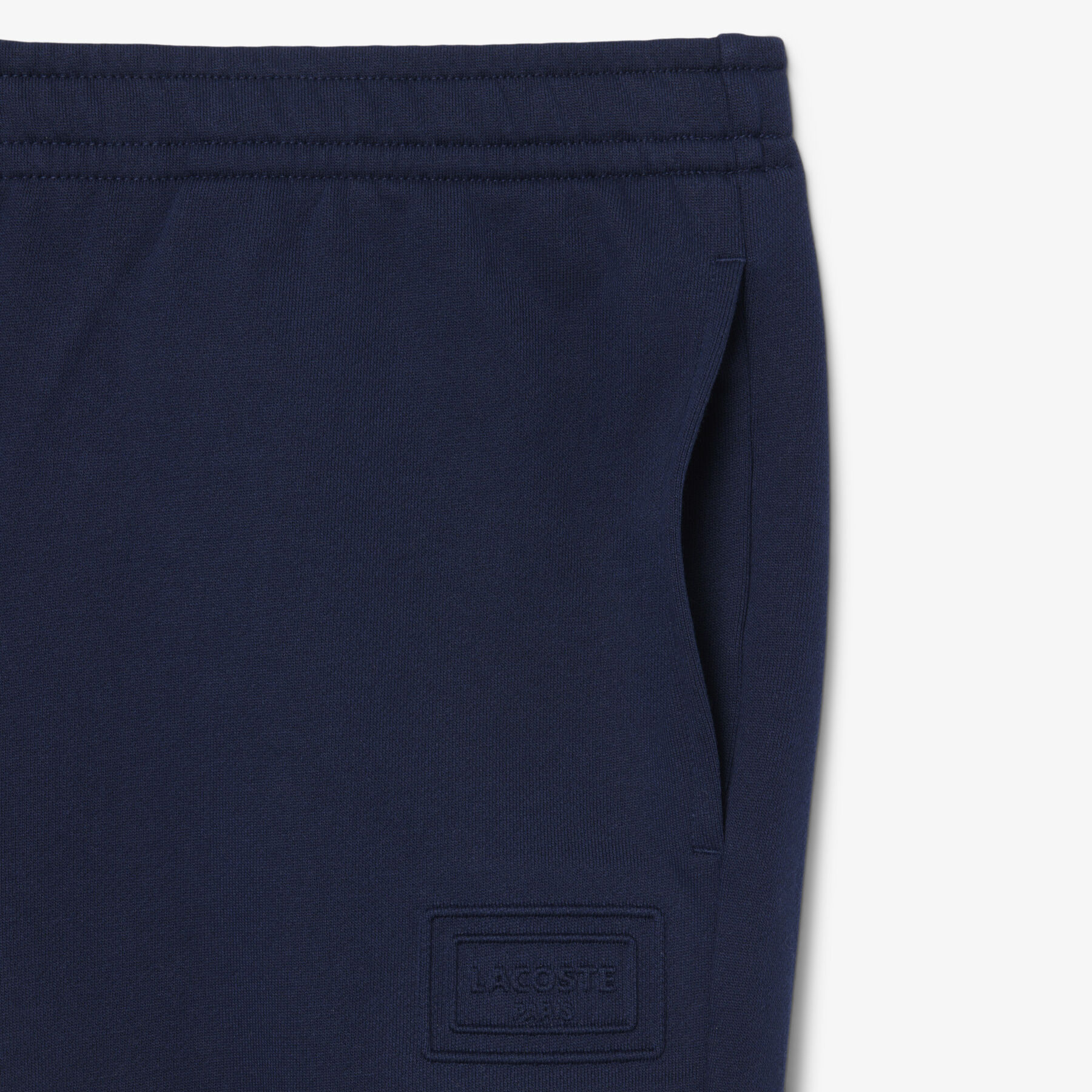 lacoste embossed branding sweatpants