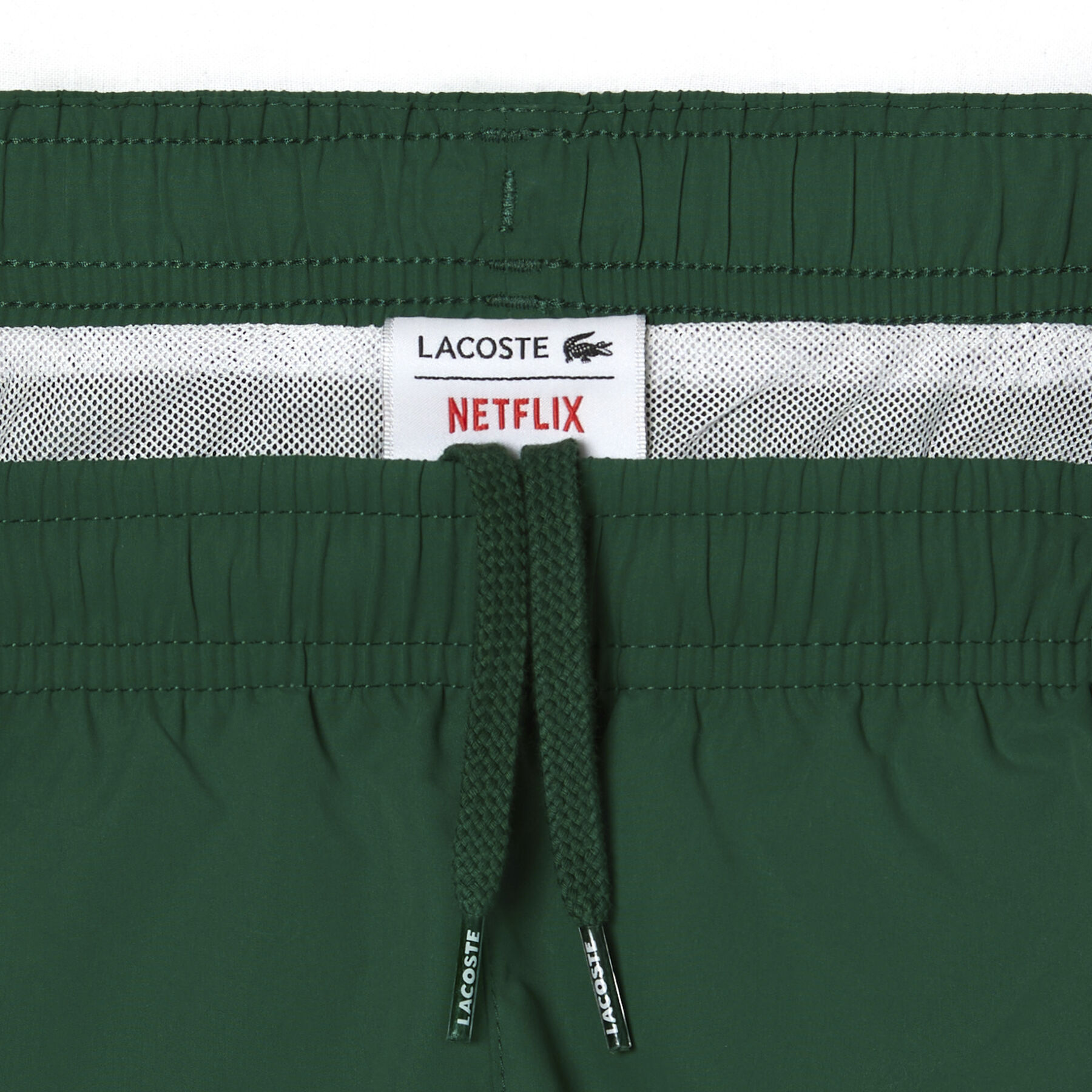 boy s lacoste x netflix contrast badge swim trunks
