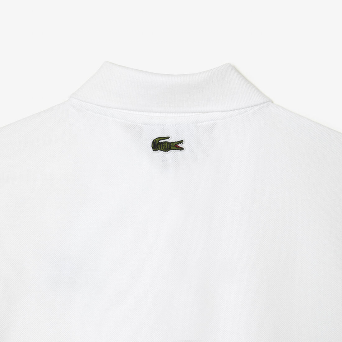 تيشيرت بولو بطبعة تمساح للنساء مجموعة Lacoste x Netflix تيشيرت بولو بطبعة تمساح للنساء مجموعة Lacoste x Netflix