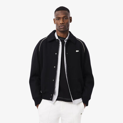 جاكيت فيرسيتي من الصوف مزين بشعار زخرفي