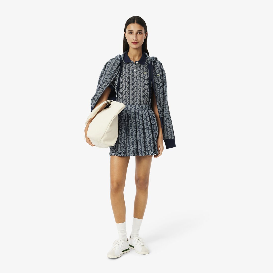 قميص بولو جاكار أحادي اللون بقصّة ضيقة قميص بولو جاكار أحادي اللون بقصّة ضيقة