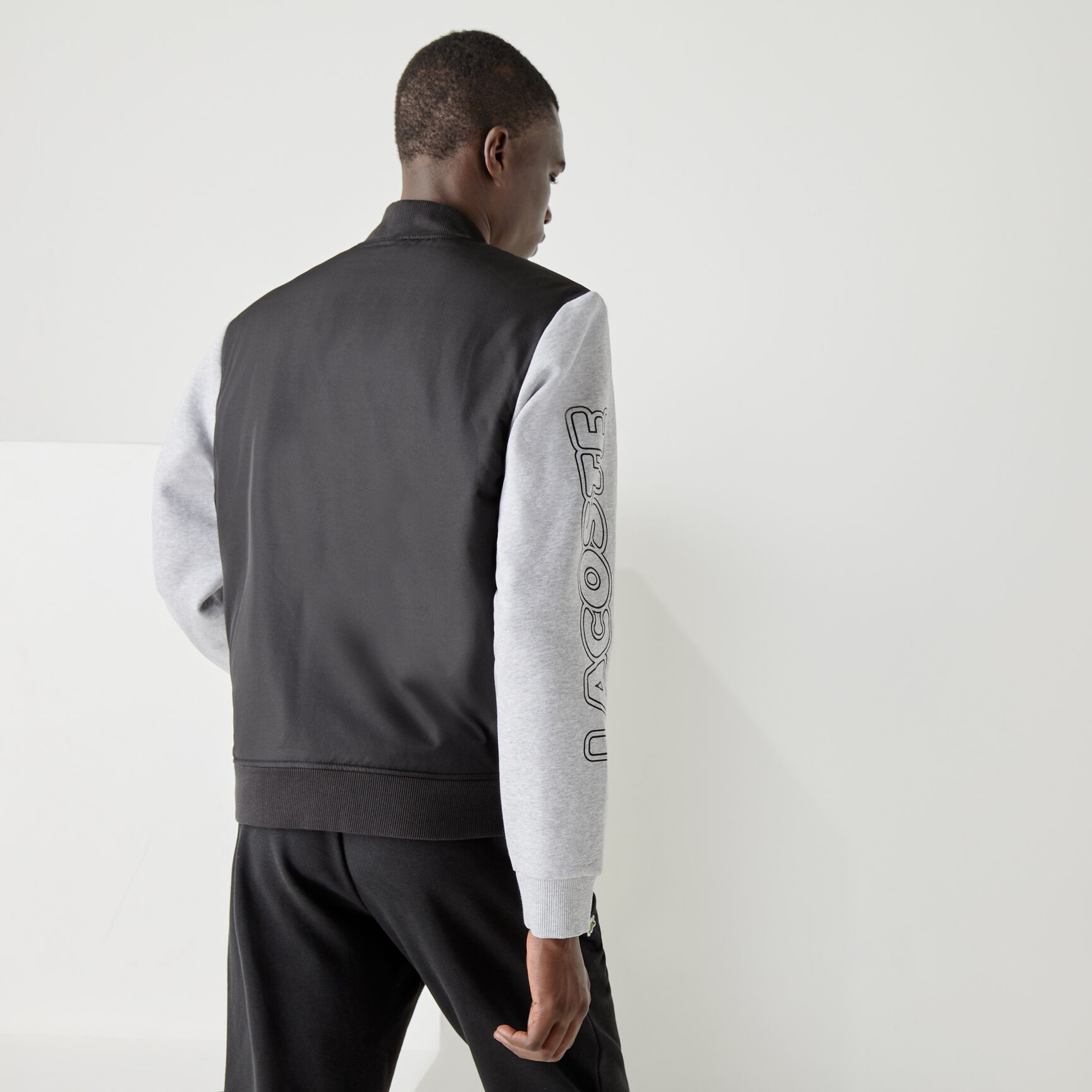 جاكيت تيدي بسحاب من الصوف مع طبعة ثنائية اللون للرجال من مجموعة Lacoste SPORT جاكيت تيدي بسحاب من الصوف مع طبعة ثنائية اللون للرجال من مجموعة Lacoste SPORT