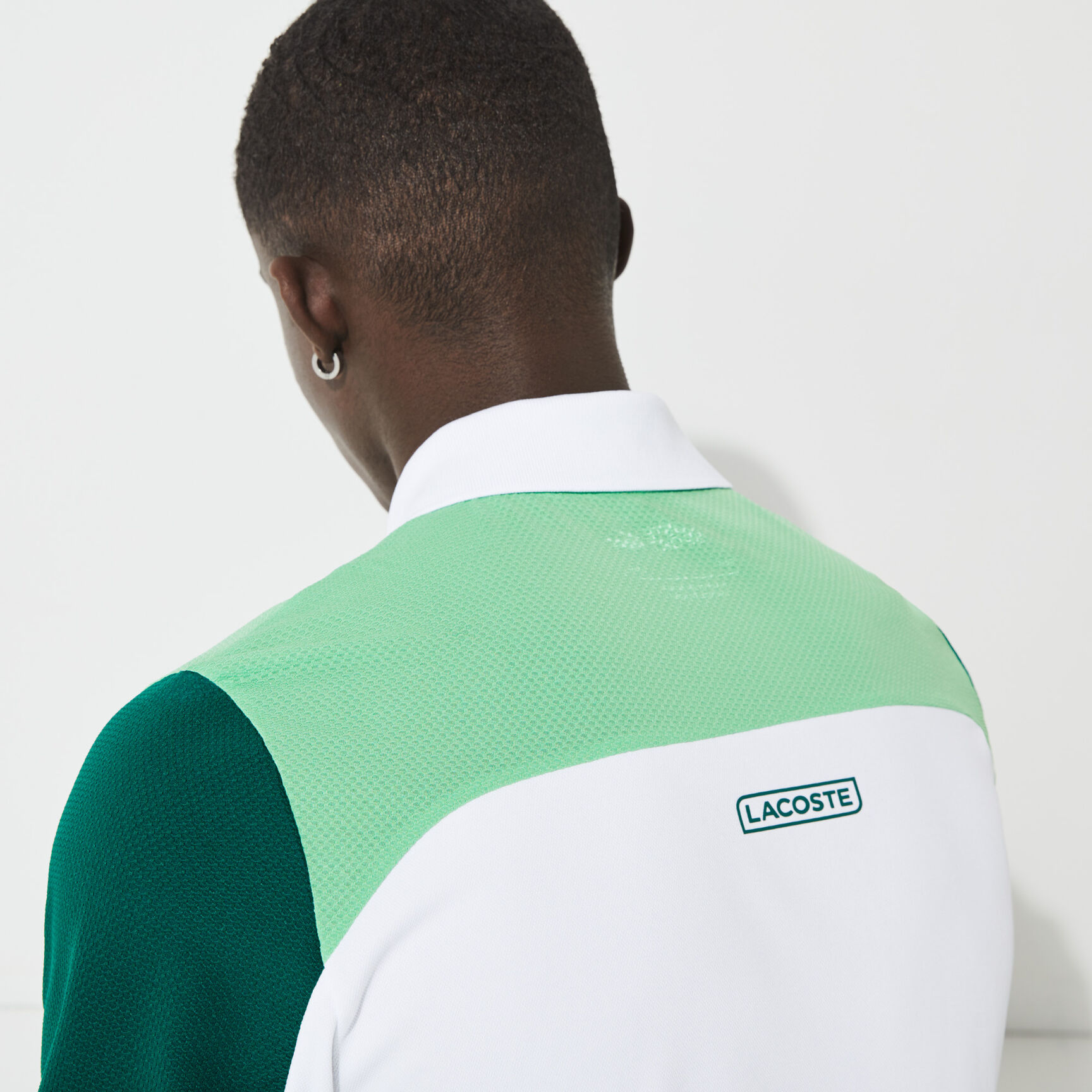 قميص بولو مسامي للتنس للرجال مع كتل لونية مجموعة Lacoste SPORT