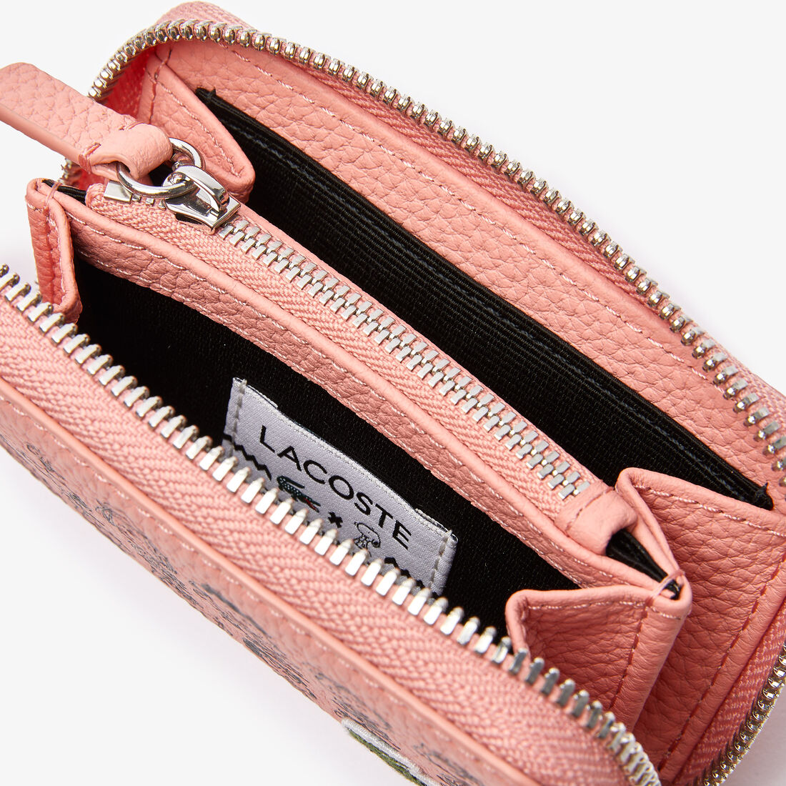 حقيبة عملات جلدية صغيرة بحبيبات صغيرة للسيدات من مجموعة Lacoste x Peanuts حقيبة عملات جلدية صغيرة بحبيبات صغيرة للسيدات من مجموعة Lacoste x Peanuts