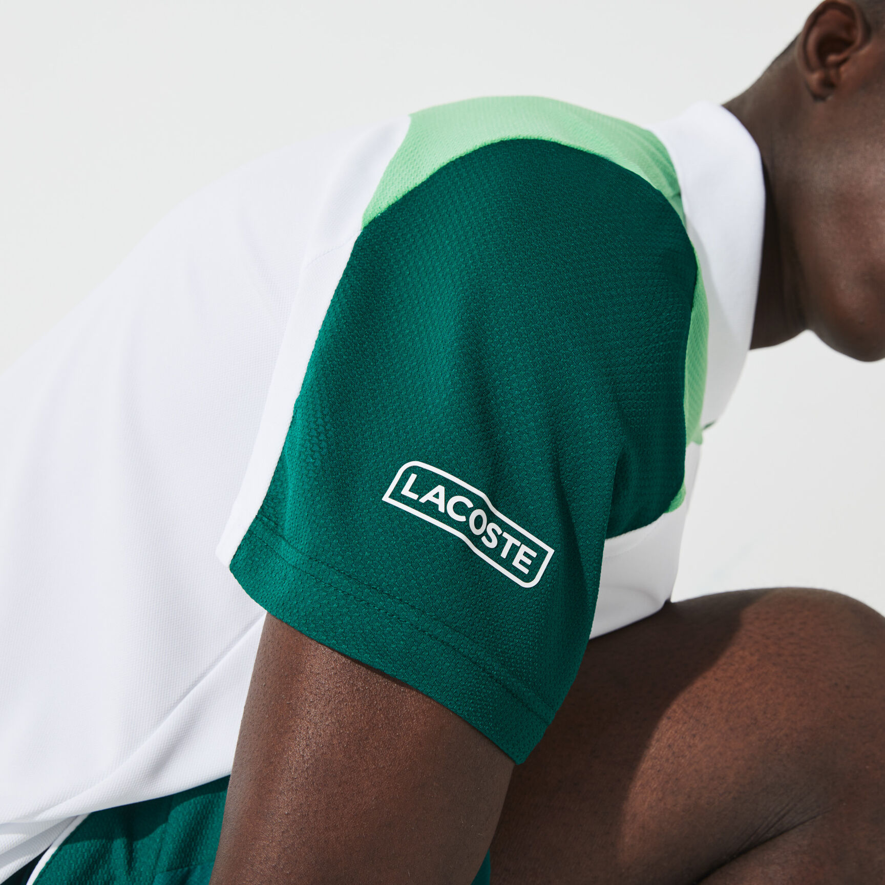 قميص بولو مسامي للتنس للرجال مع كتل لونية مجموعة Lacoste SPORT