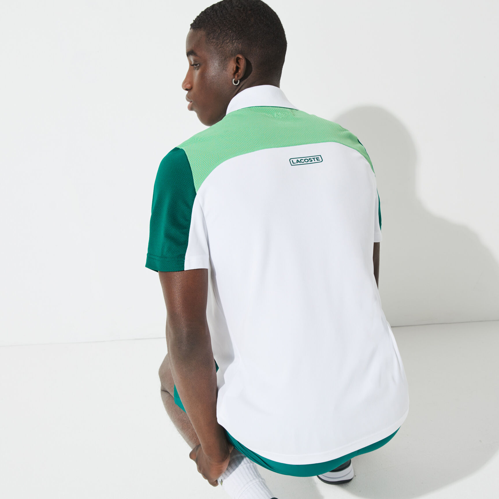 قميص بولو مسامي للتنس للرجال مع كتل لونية مجموعة Lacoste SPORT