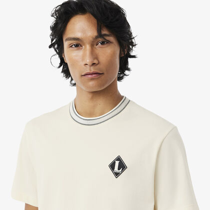 تيشيرت فرنسي الصنع مزين بشعار المااركة