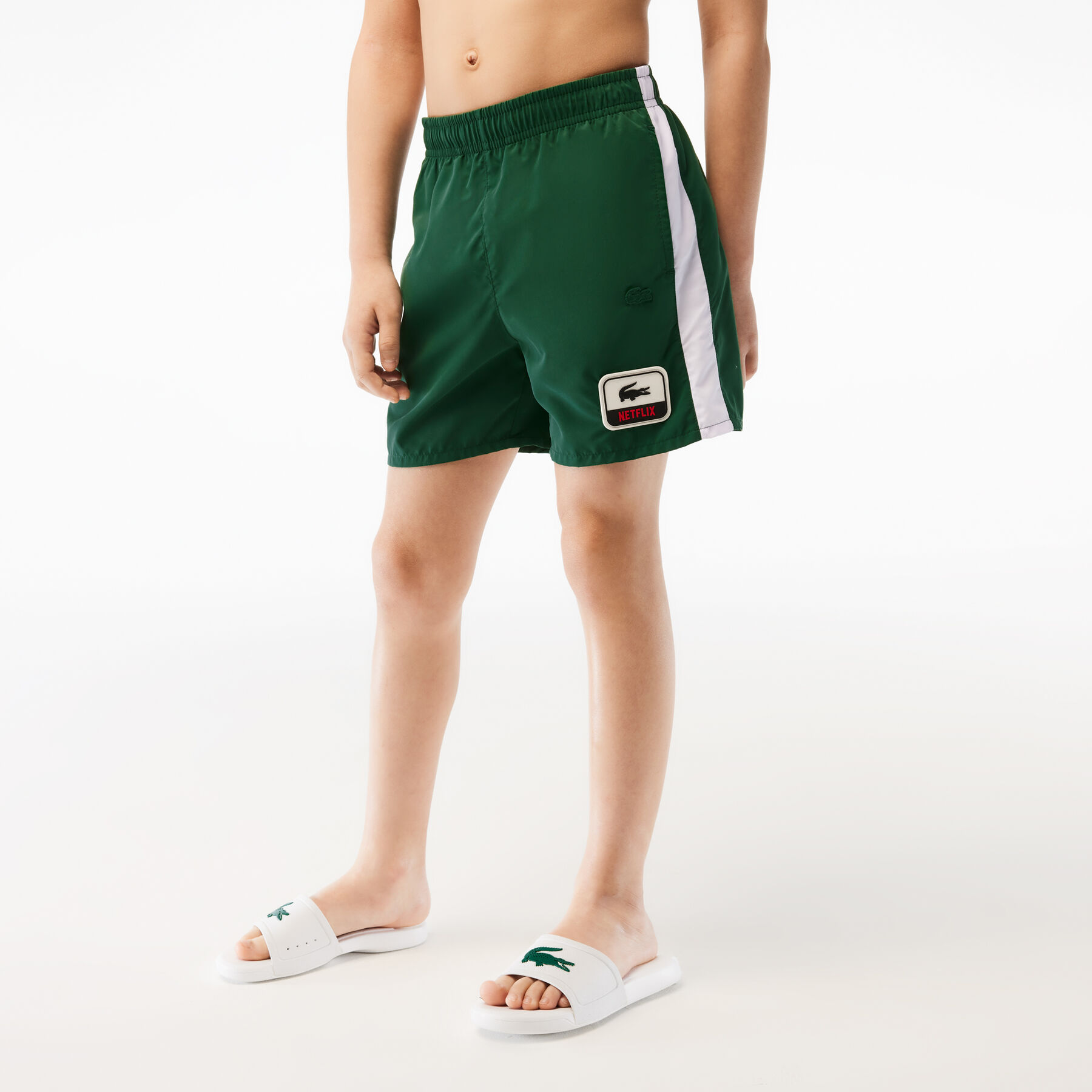boy s lacoste x netflix contrast badge swim trunks