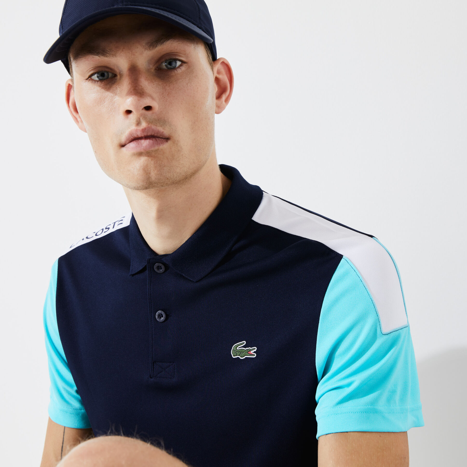 قميص بولو من مجموعةLacoste SPORT محيك من البيكيه ويسمح بمرور الهواء للرجال قميص بولو من مجموعةLacoste SPORT محيك من البيكيه ويسمح بمرور الهواء للرجال