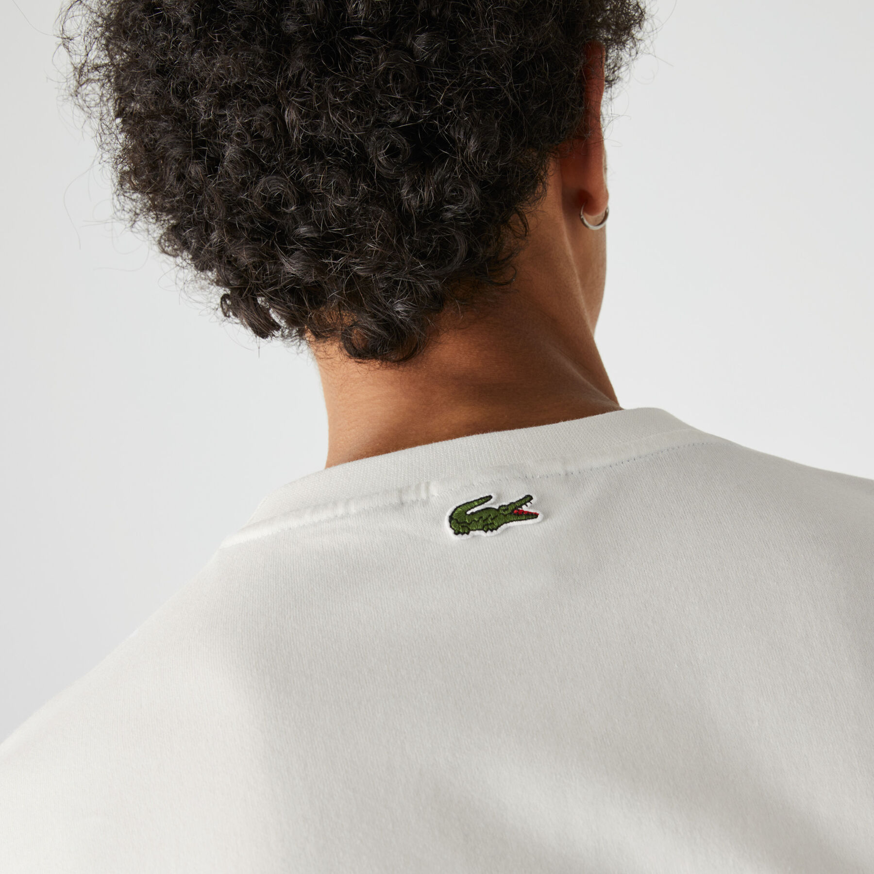 لاكوست تي شيرت قطن مع طبعة وجه مميزة من مجموعة lacoste live للجنسين