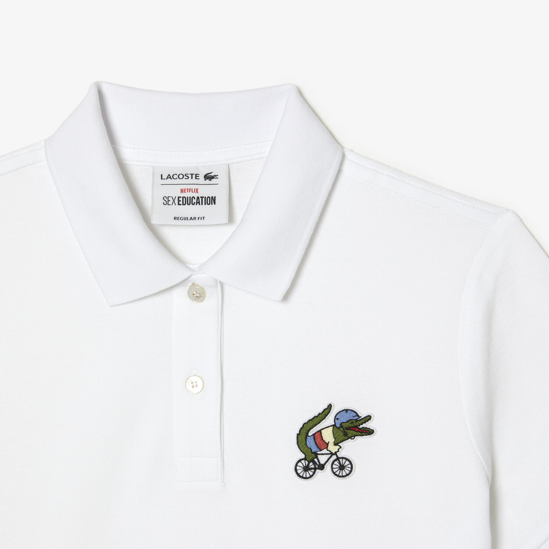 تيشيرت بولو بطبعة تمساح للنساء مجموعة Lacoste x Netflix لاكوست تيشيرت بولو بطبعة تمساح للنساء مجموعة lacoste x netflix