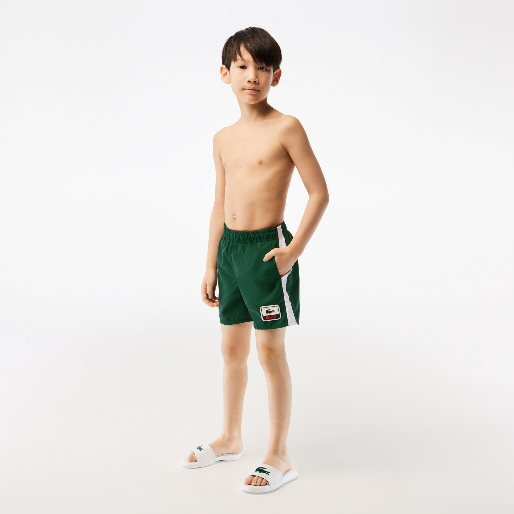 boy s lacoste x netflix contrast badge swim trunks