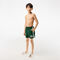 boy s lacoste x netflix contrast badge swim trunks