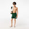 boy s lacoste x netflix contrast badge swim trunks