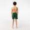 boy s lacoste x netflix contrast badge swim trunks