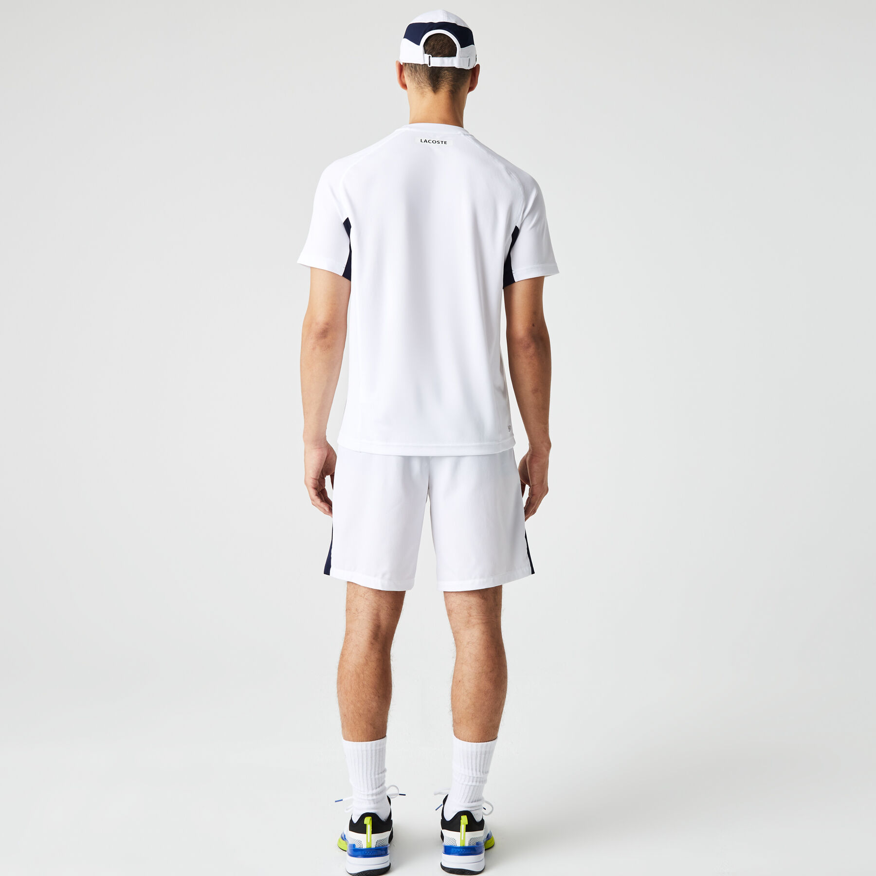 لاكوست تيشيرت تنس بيكيه سريع الجفاف بتصميم مقسم بألوان للرجال مجموعة lacoste sport
